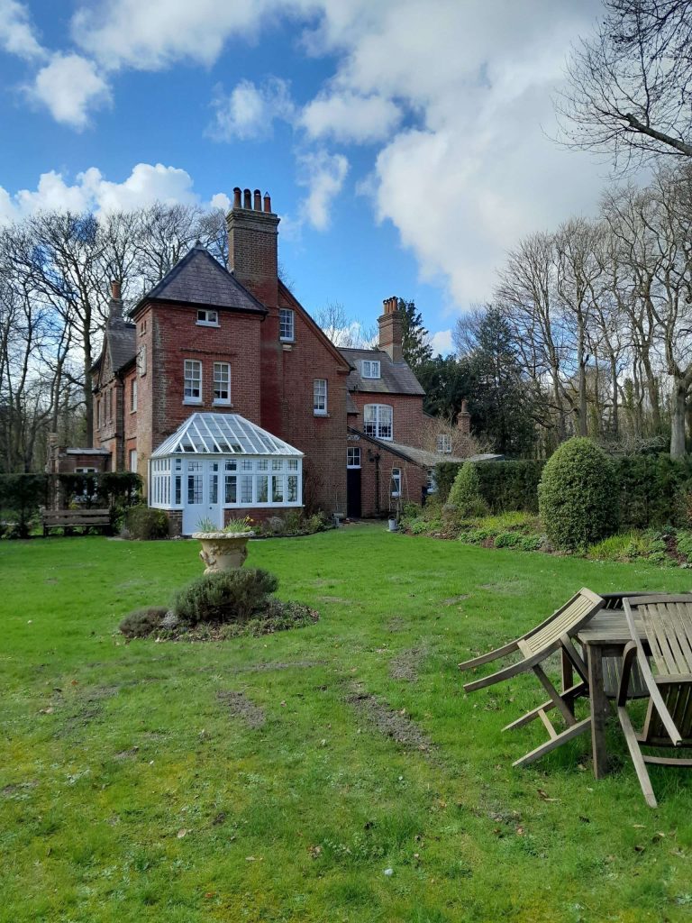 A well-maintained garden cottage (Max Gate)